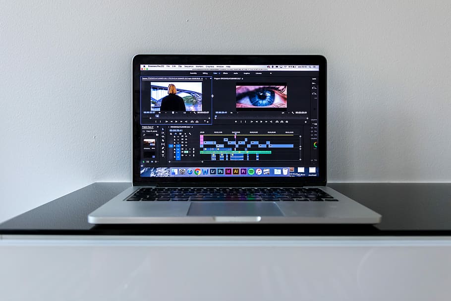 MacBook Pro on black desk, turned on MacBook Pro, technology HD wallpaper