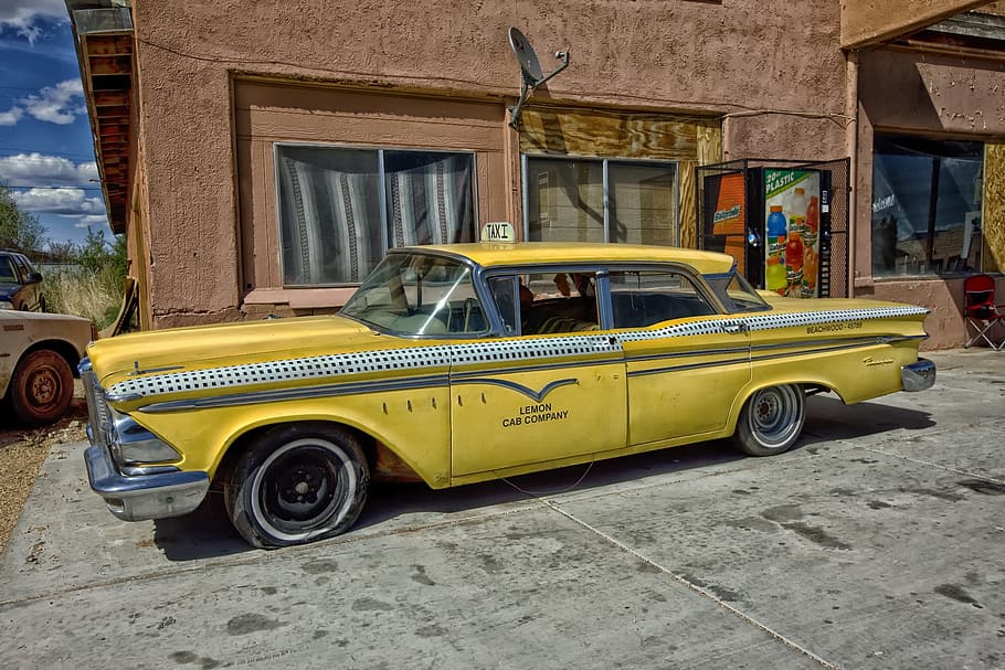 classic yellow sedan taxi cab parked near concrete building, vintage, HD wallpaper