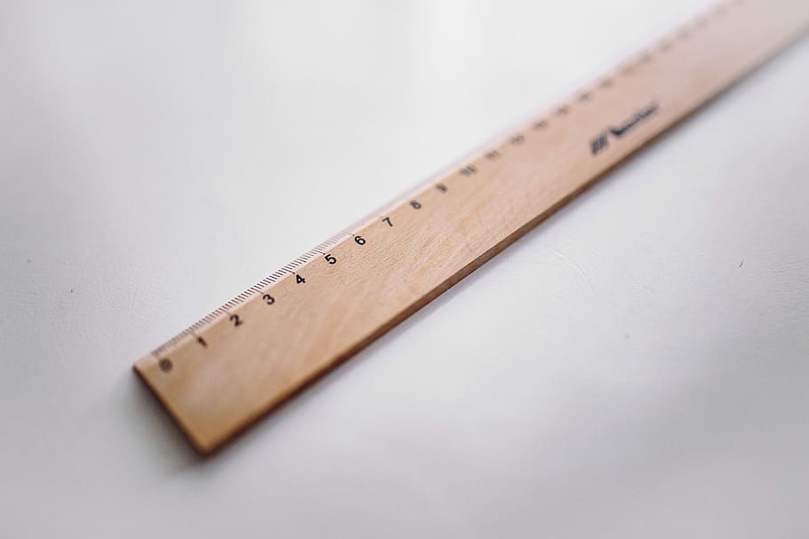 Bicycle paper clips and a wooden ruler, stationery, instrument of Measurement