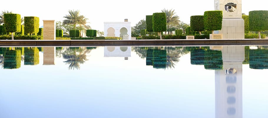 white concrete structure and trees reflected on water during daytime, swimming pool HD wallpaper