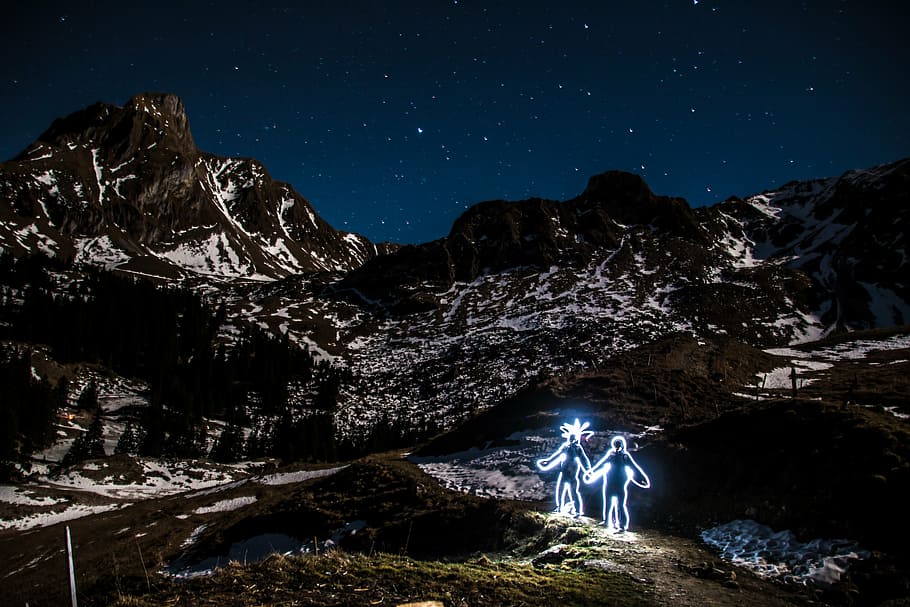 two human neon figures on mountain alps, light graffiti, light drawing HD wallpaper