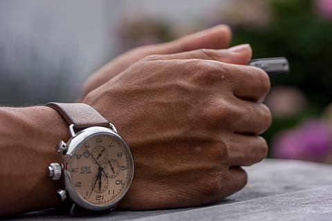 person wearing chronograph watch, person hand wearing round silver-colored chronograph watch HD wallpaper
