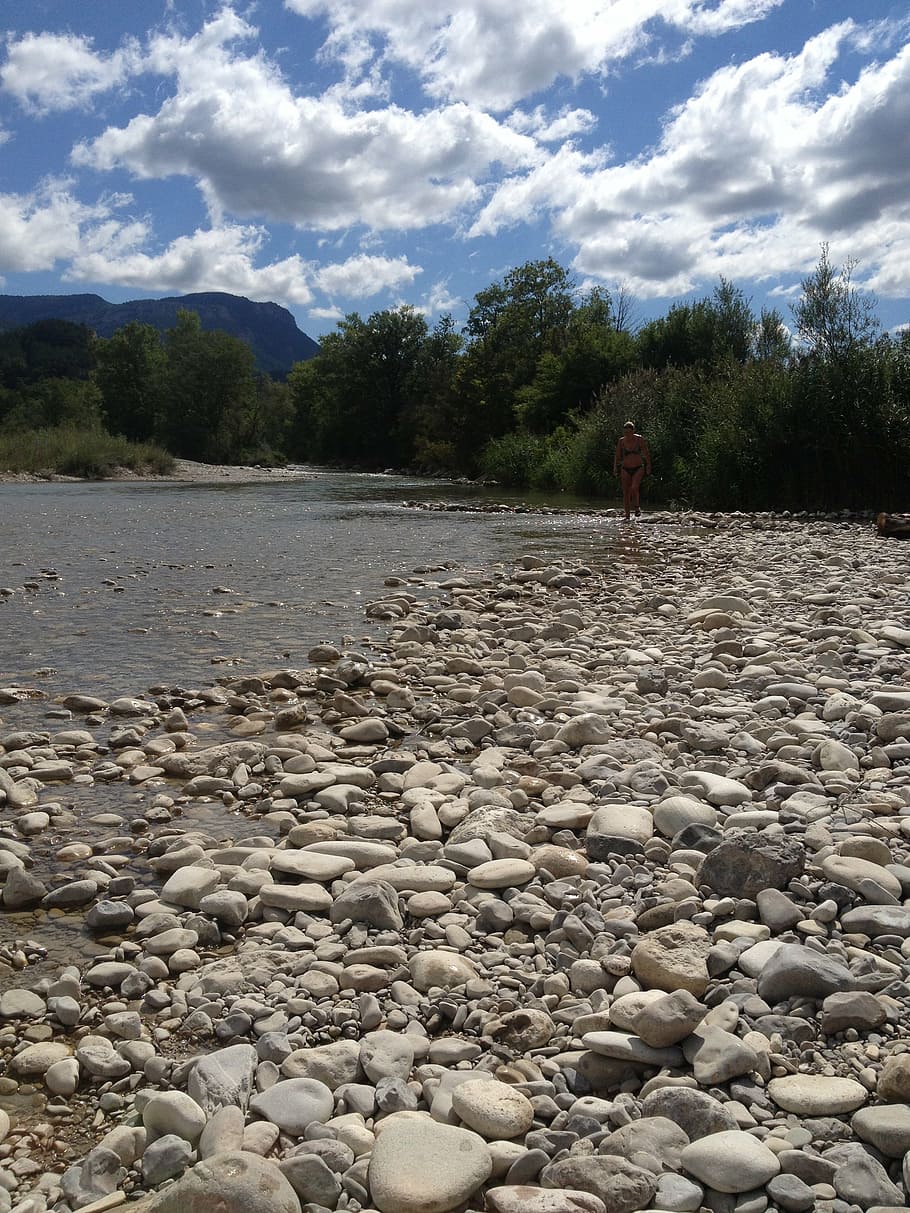 river, stones, water, flow, cloud - sky, solid, one person HD wallpaper