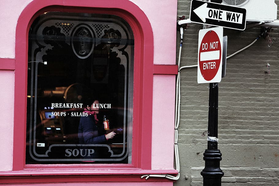 photo of pink building near pole, person, taking, store, glass HD wallpaper