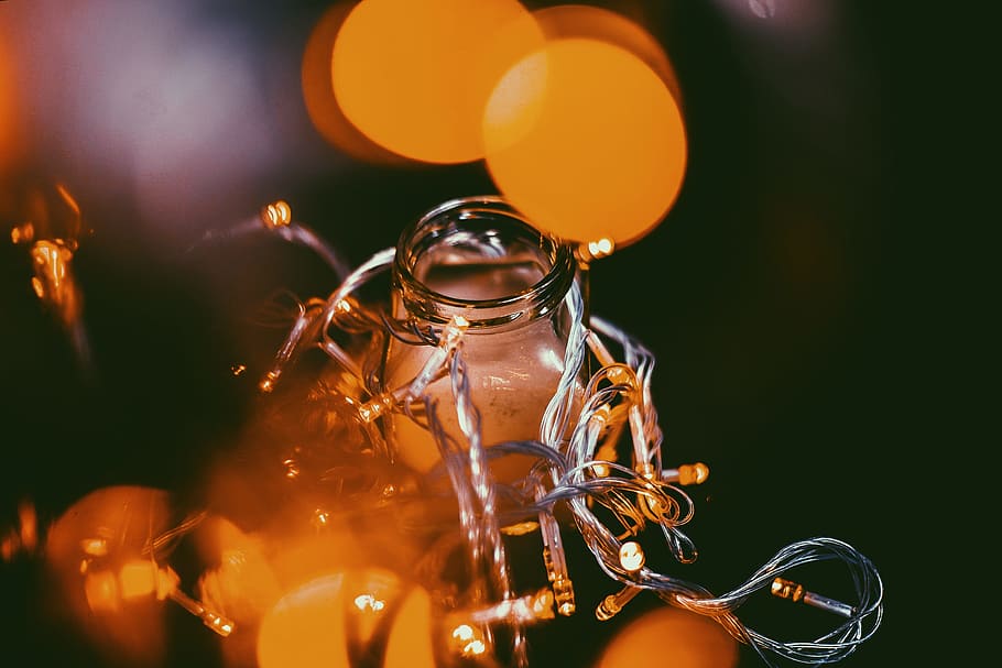 close-up photo of string lights, boke photography of orange lights with glass HD wallpaper