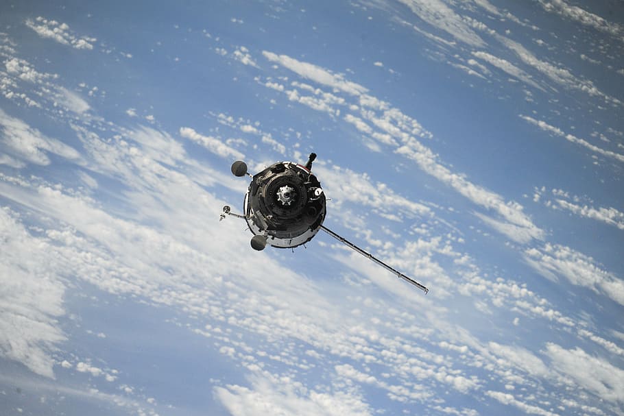 gray satellite orbiting earth, space, spaceship, station, science