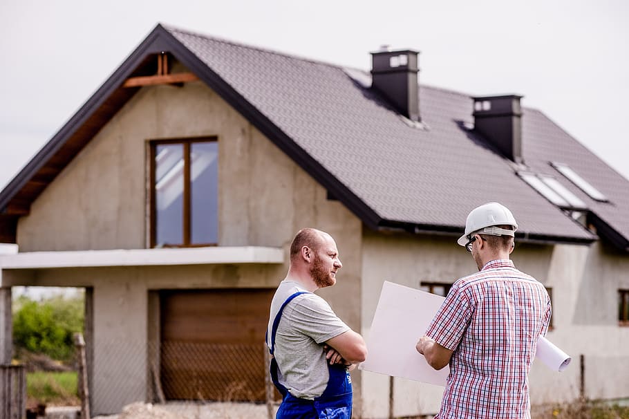 two men standing in front of beige house, building, professional HD wallpaper