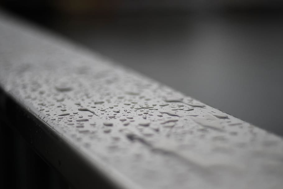selective focus photography of water drops on gray surface HD wallpaper