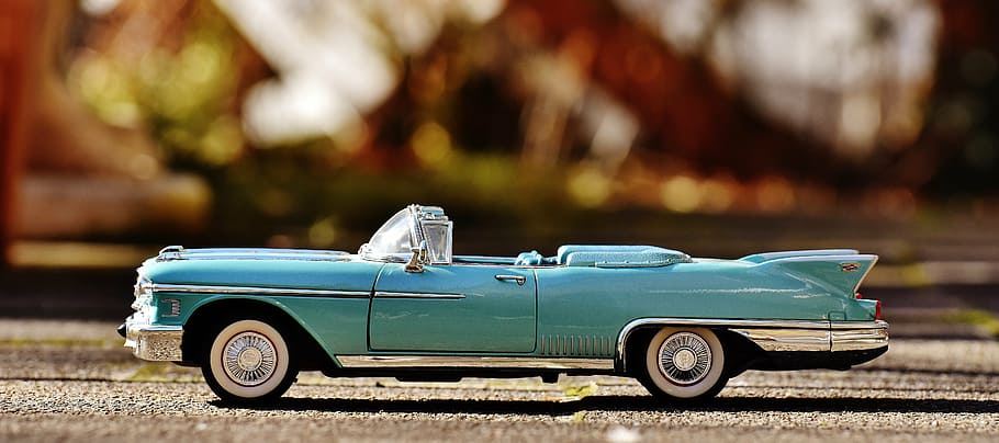 selective focus photography of teal convertible coupe die-cast toy on brown surface, HD wallpaper