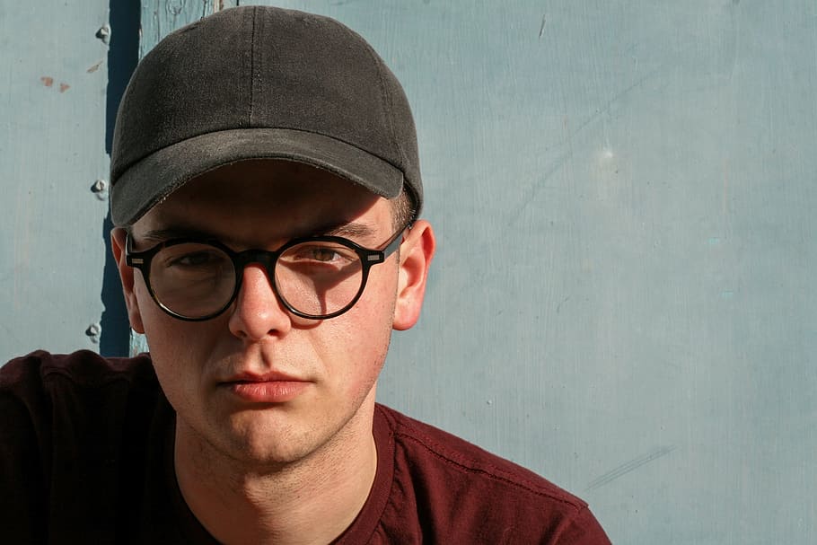 man wearing black framed glasses and cap and maroon crew neck shirt ruled of third photography shot, HD wallpaper