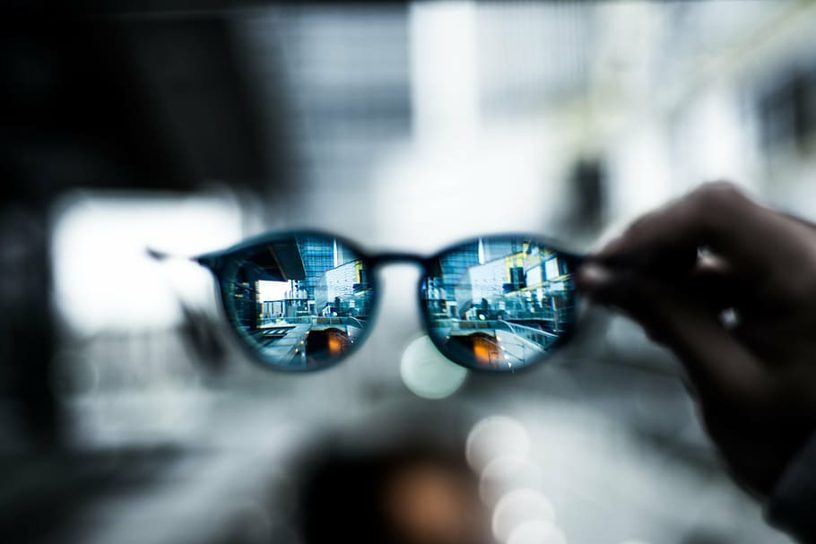 selective focus photography of person holding Clubmaster-style sunglasses, HD wallpaper