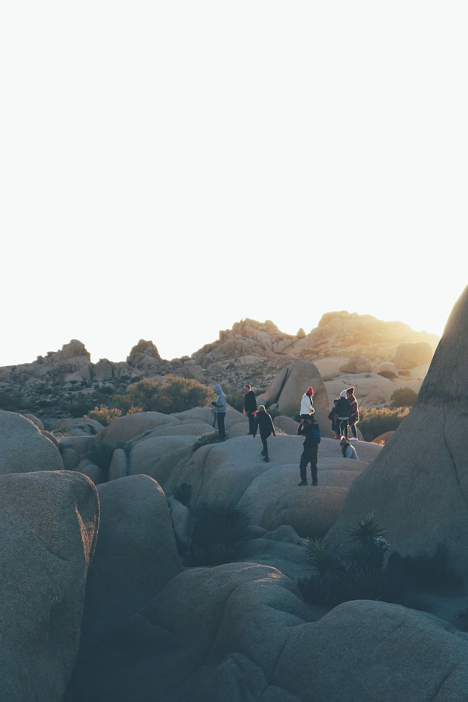 people standing on rock formations during daytime, photography of people walking on top of boulders HD wallpaper