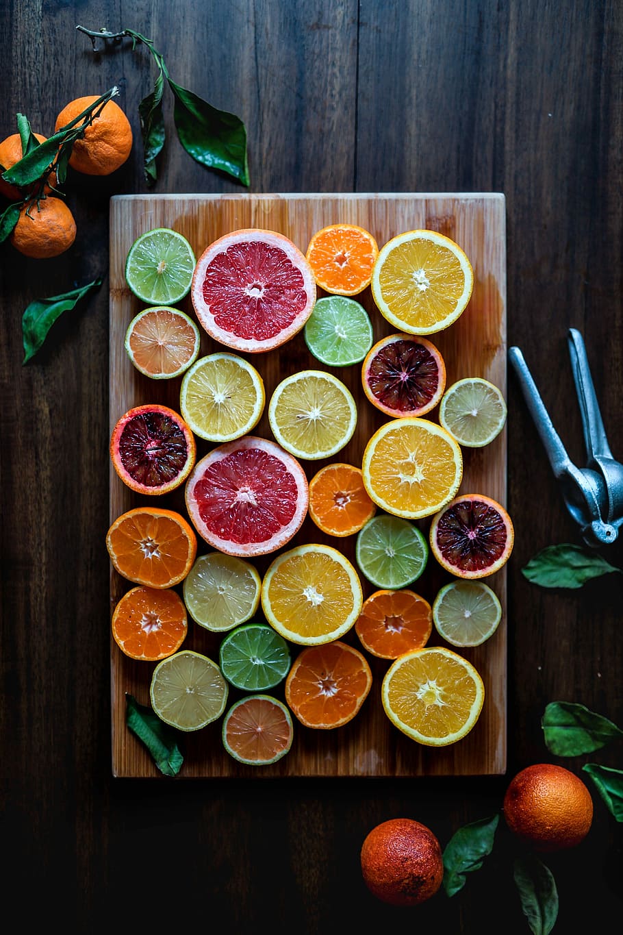 assorted sliced citrus fruits on brown wooden chopping board, sliced fruits on brown wooden chopping board HD wallpaper