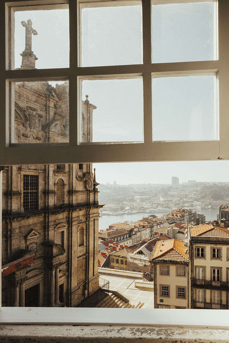 opened white wood-framed glass window, photo of gray concrete cathedral during daytime HD wallpaper