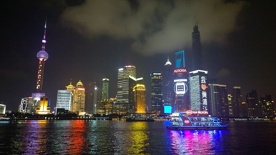 white ship sailing in front of buildings at night, shanghai HD wallpaper