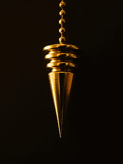 photo of stainless steel cone pedant, pendulum, chain, gold HD wallpaper
