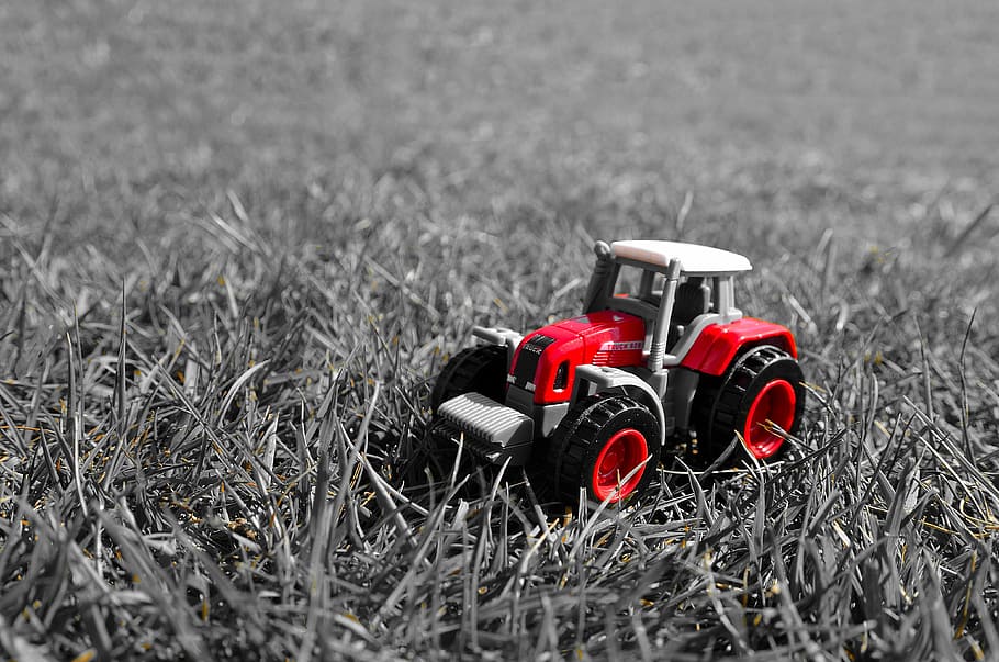 Small Red Toy Tractor in grass, machine, miniature, monochrome HD wallpaper