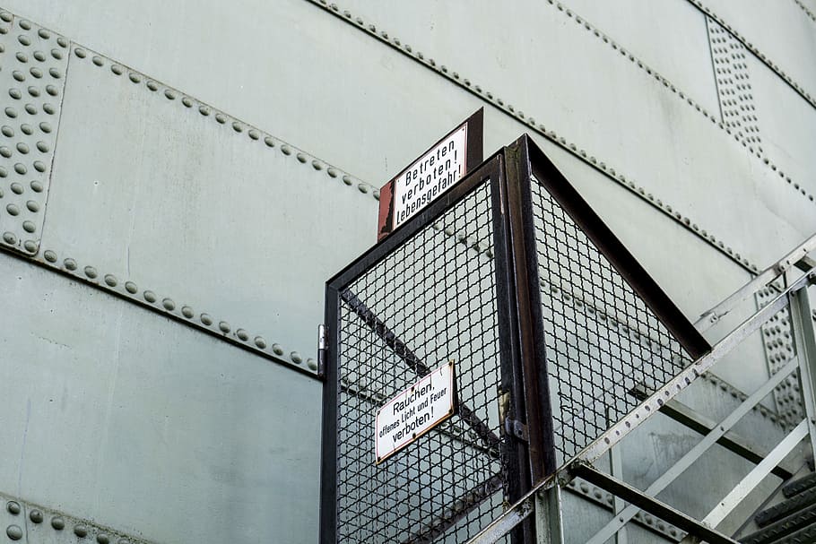 brown steel ladder, low angle photography of building exit ladder HD wallpaper