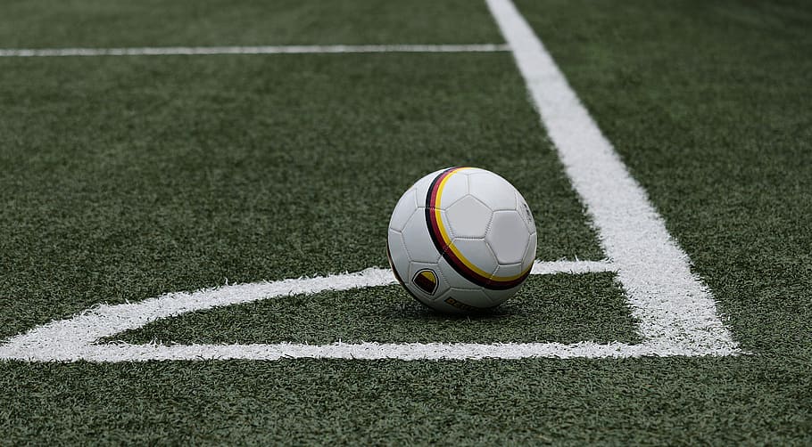 white soccer ball on grass field near line, football, corner