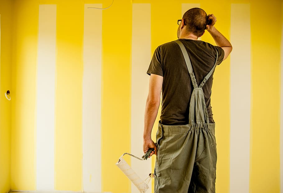 man wearing brown shirt and overalls holding paint roller, building HD wallpaper