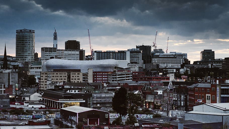 concrete building and houses under gray sky, photo of city and buildings, HD wallpaper