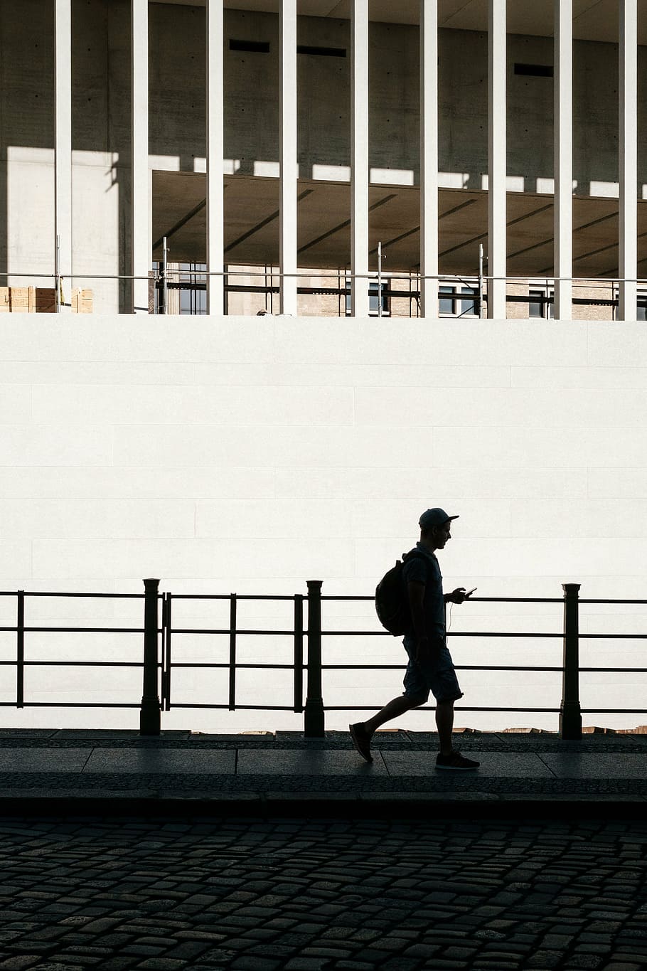 silhouette of a man walking using phone, architecture, building HD wallpaper