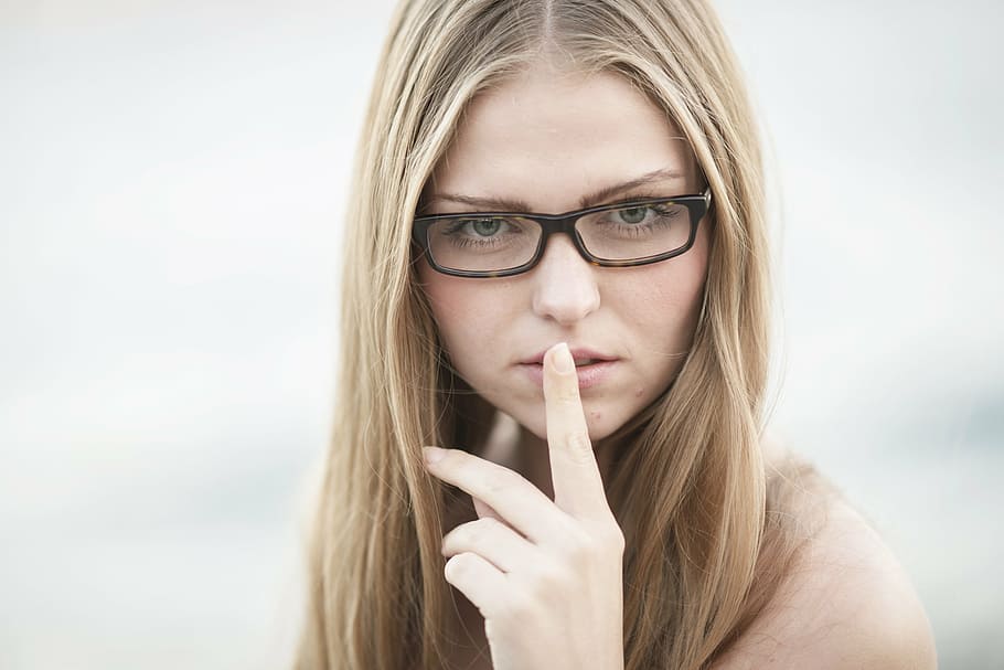 woman wearing black eyeglasses with index finger on her lips, HD wallpaper