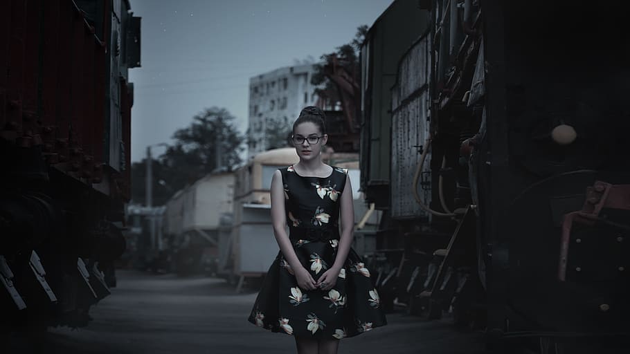 woman in black and white floral sleeveless dress, girl, steam locomotive