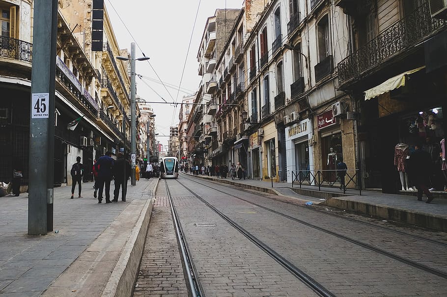 Modern train, tram near sidewalk under cloudy sky, building, architecture HD wallpaper