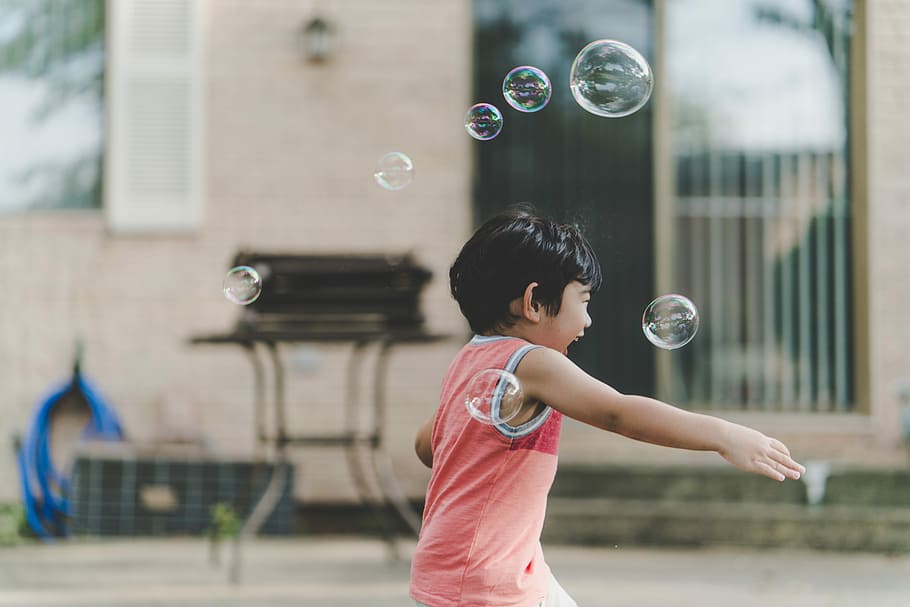 photo of a boy having fun playing with bubbles, outdoors, people HD wallpaper
