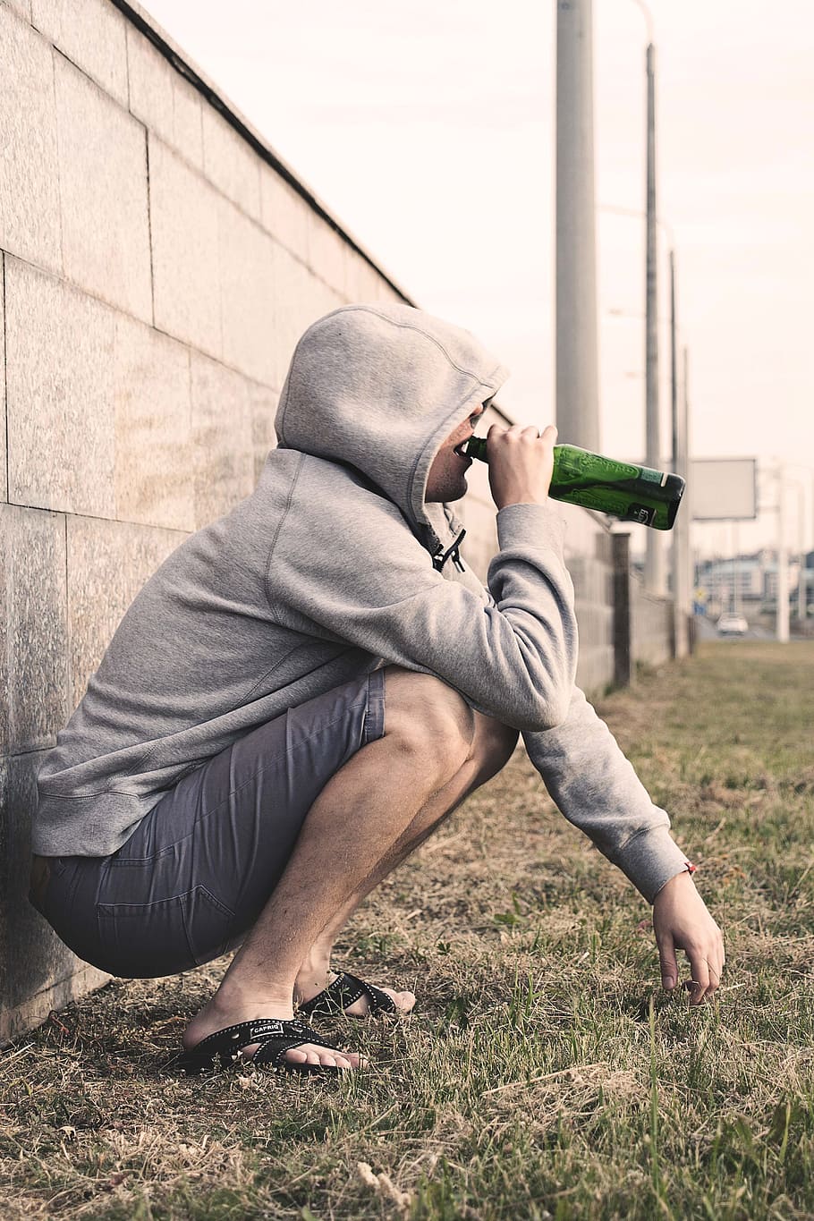 man in gray hoodie drinking bottled drink, alcoholism treatment, HD wallpaper