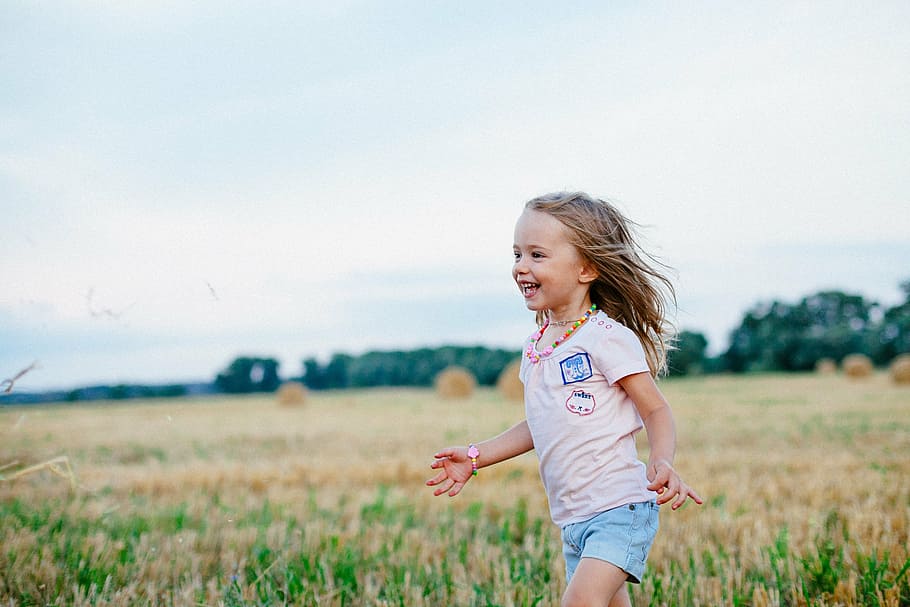 girl's pink crew-neck shirt, joy, field, summer, smile, nature HD wallpaper