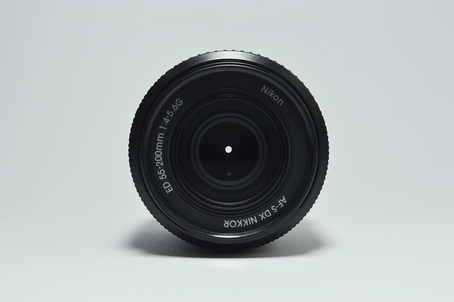 black Nikkor camera lens for Nikon camera, round, shadow, wall HD wallpaper