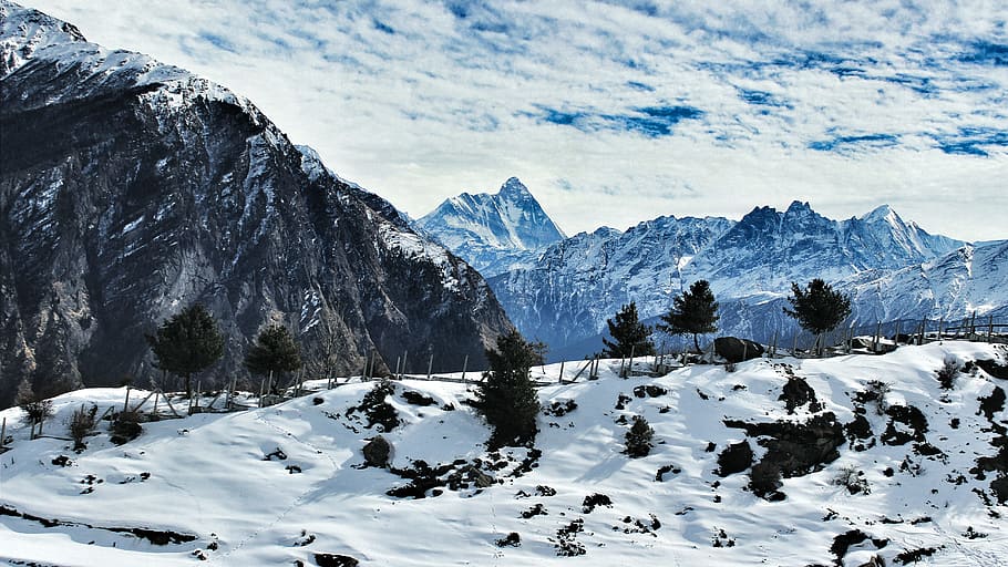 landscape photography of mountains, snow covered field at the foot of mountain HD wallpaper