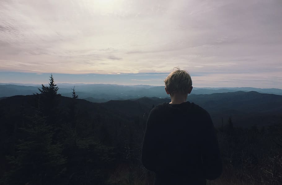 boy standing on the cliff, black, crew, neck, sweater, facing HD wallpaper