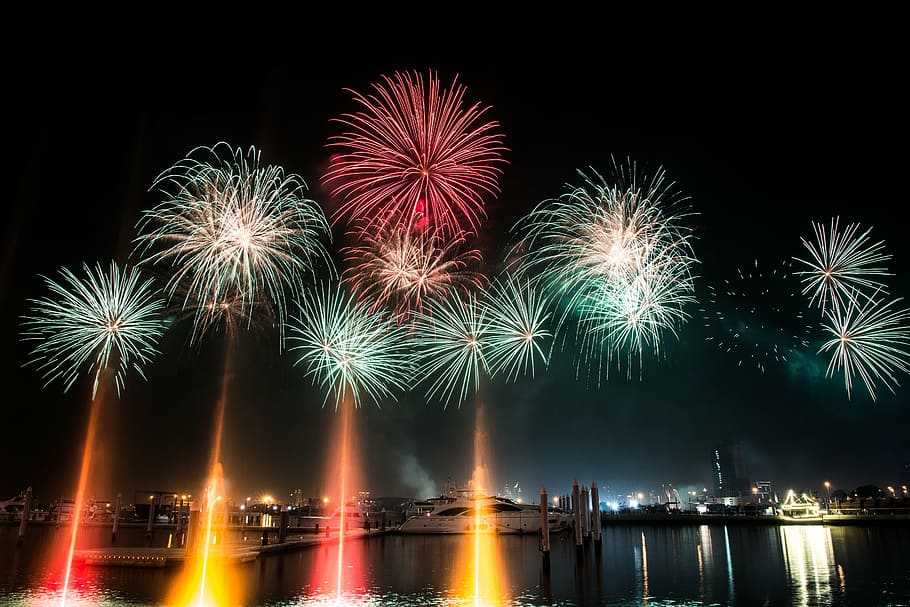 photo of firecrackers in sky, boat, dubai, fireworks, marina