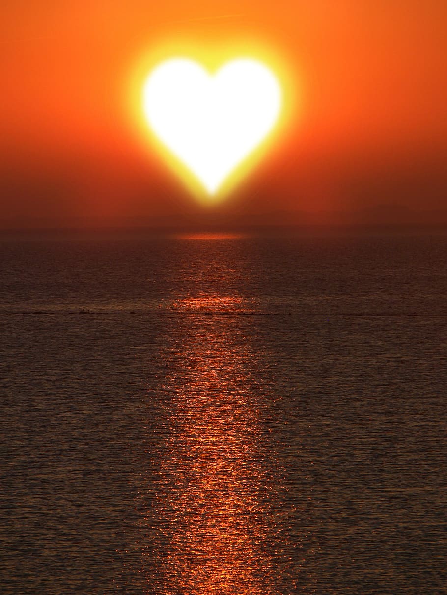 heart-shaped sun over body or water, background, texture, love