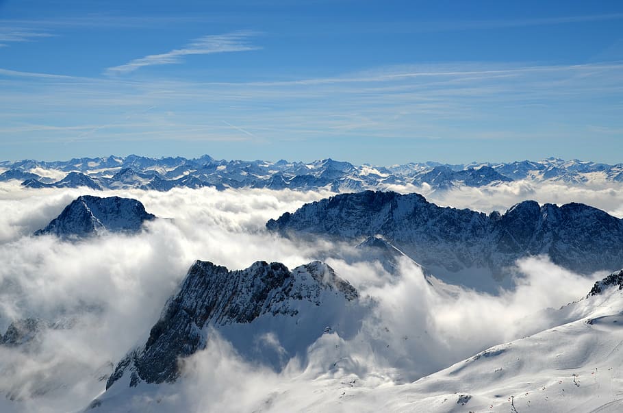 aerial photography of mountain covered with snow under blue sky HD wallpaper