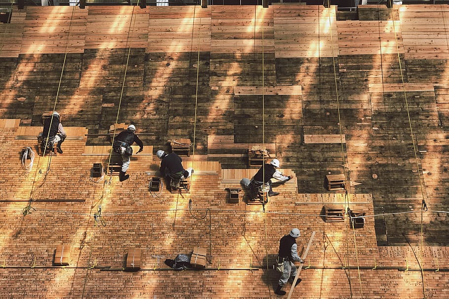 group of people hanging on wall during daytime, photo of person working on floor HD wallpaper