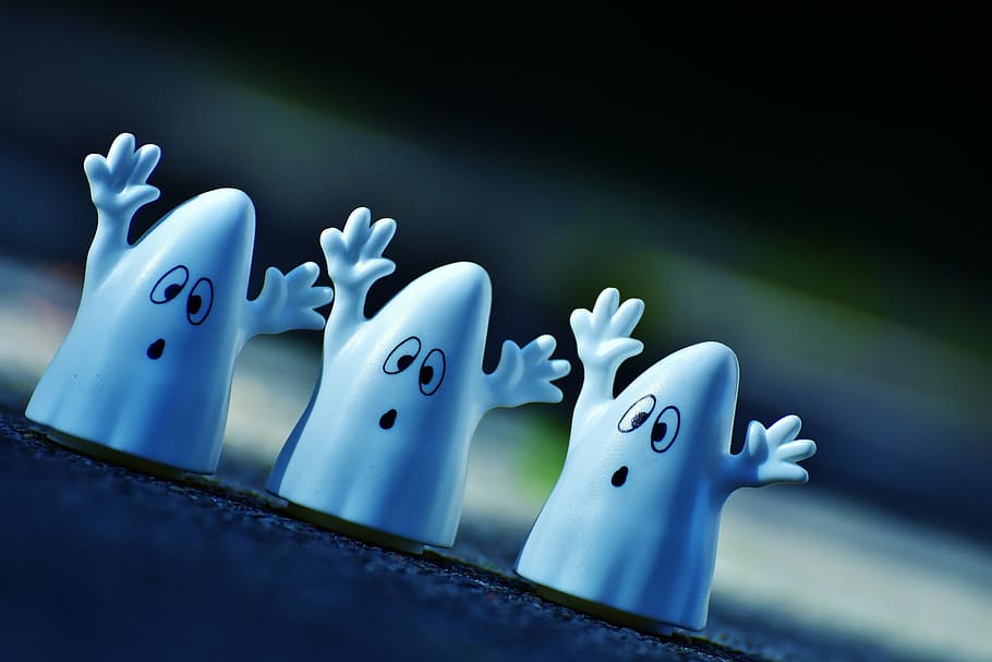 selective focus photography of three white ghost figures, halloween