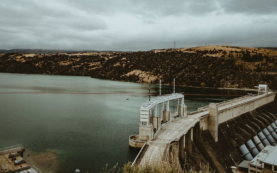 concrete bridge near dam, aerial view of dam near bridge during daytime HD wallpaper