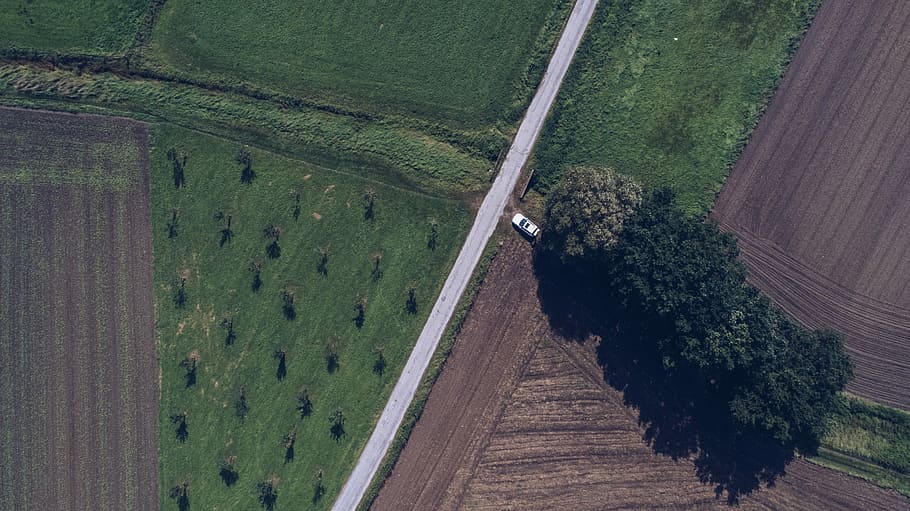 grey and brown stone, aerial photography of white vehicle on road at daytime HD wallpaper