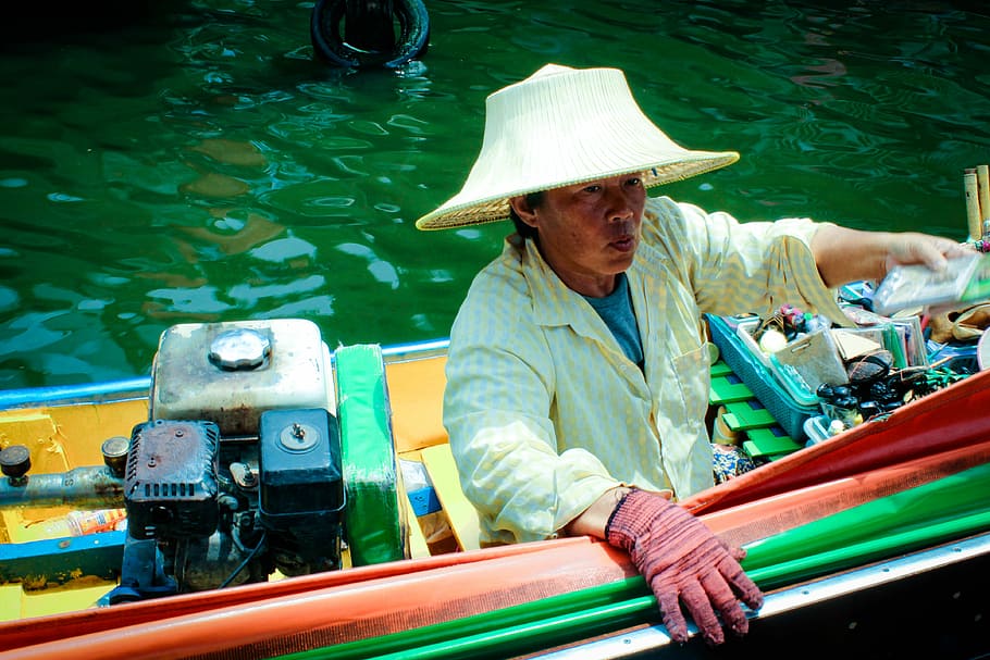 Boat Market, person getting out of boat, woman, female, asian
