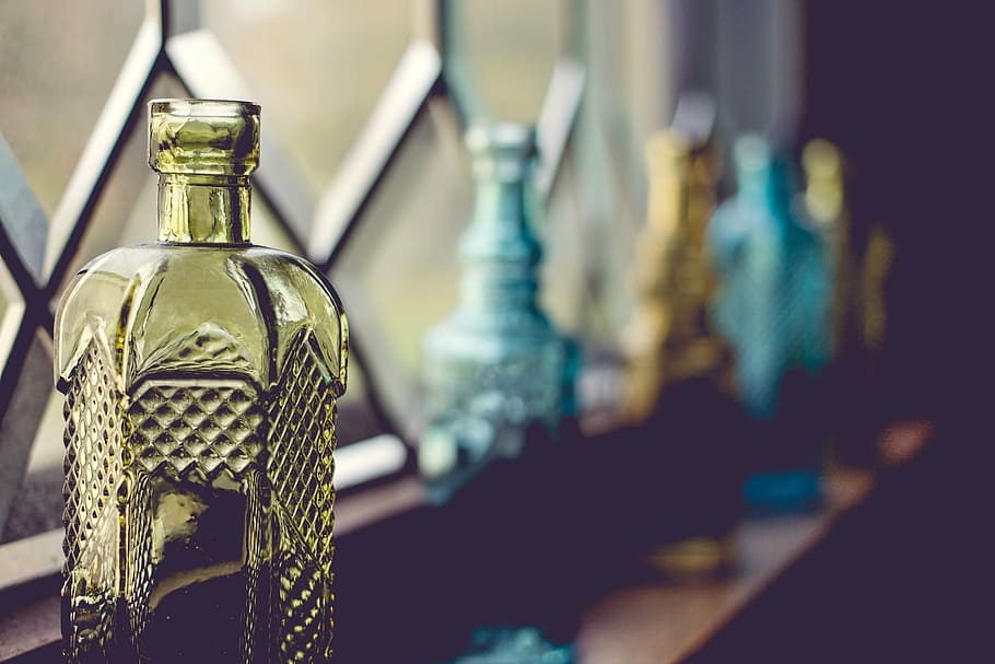 macro shot of yellow glass bottle, bottles, window, decorative HD wallpaper