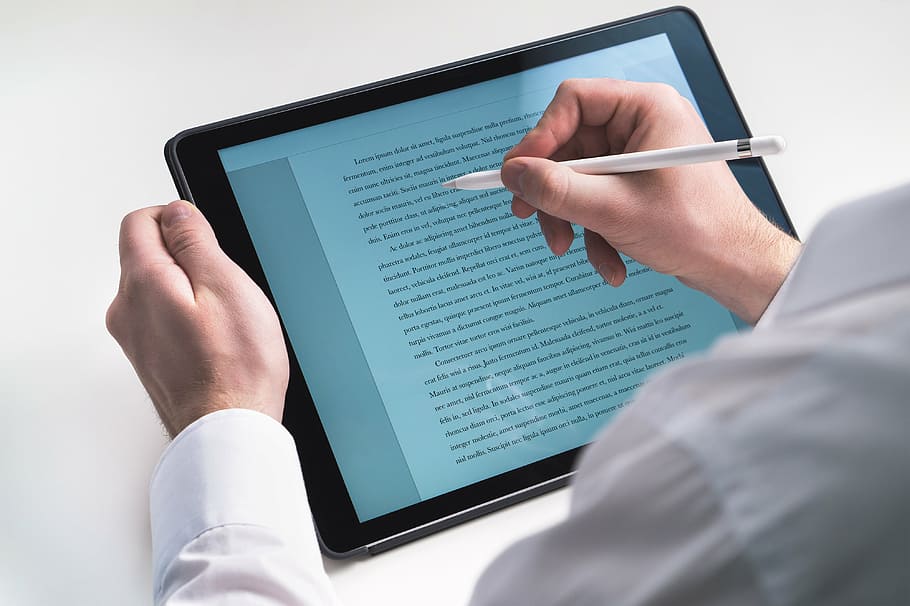 person using tablet computer, stylus, secretary, reading, pencil