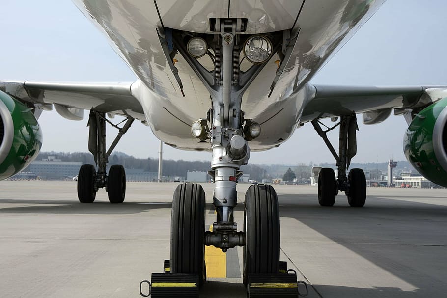 low angle photography of airplane, chassis, nosewheel, wheels HD wallpaper