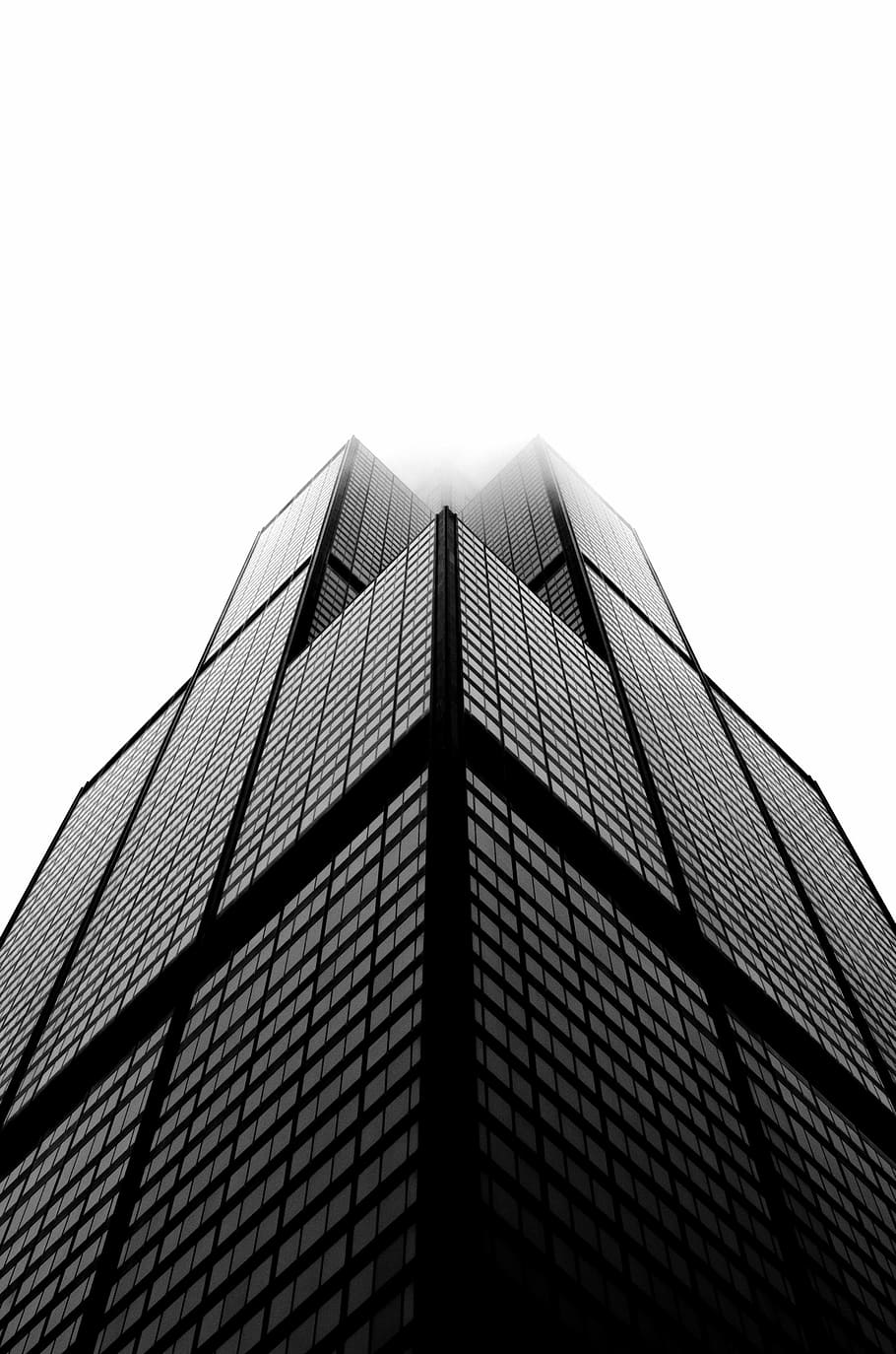 aerial photo of building under white sky, bottom view of black and gray building HD wallpaper