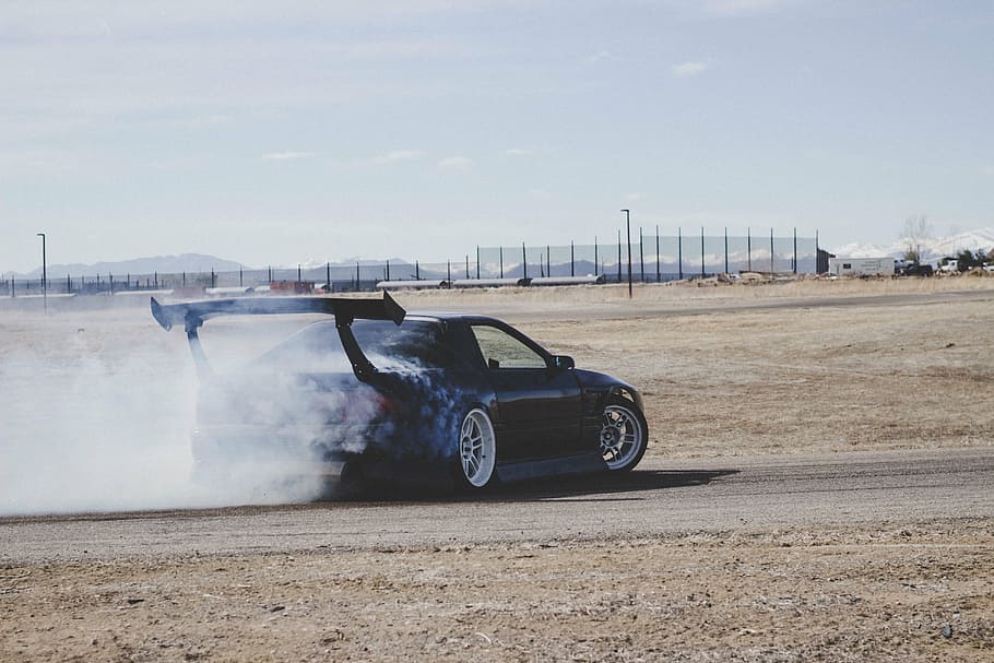 black coupe drifting on sand during daytime, car, vehicle, transportation HD wallpaper