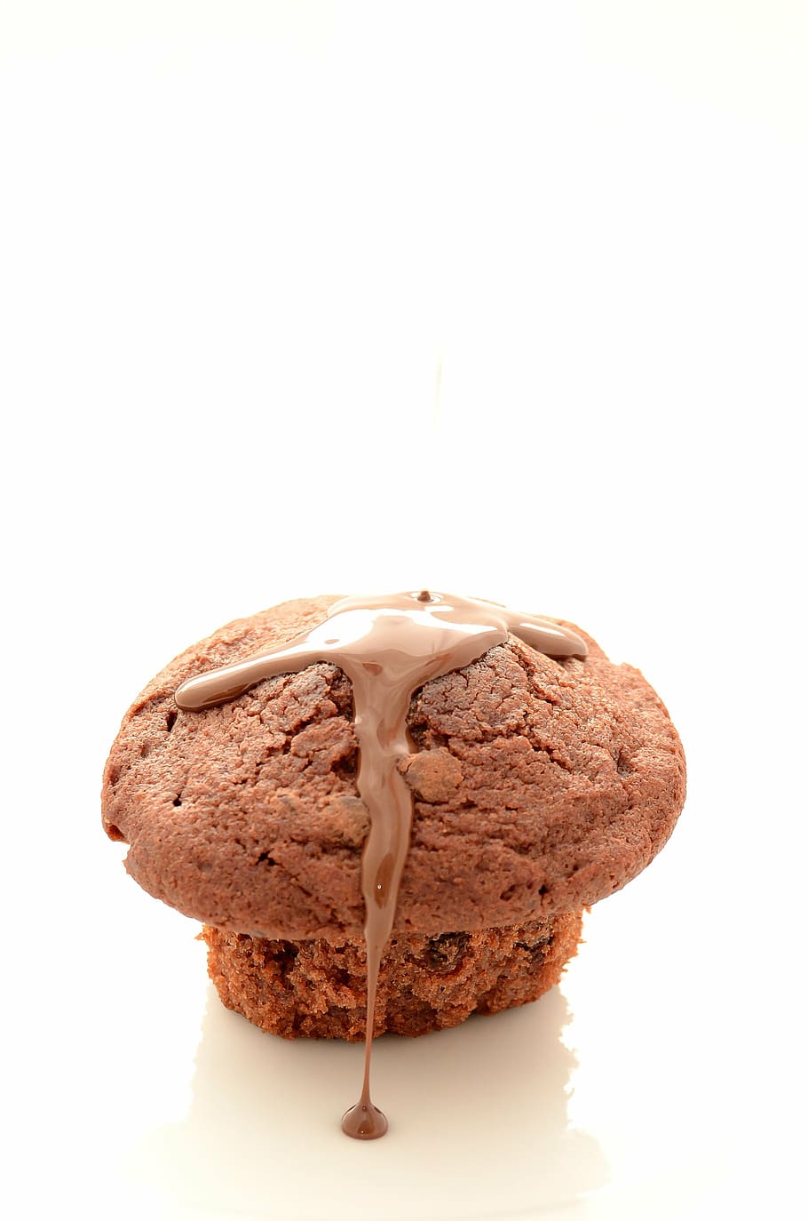 muffin with chocolate syrup on top of white surface, bun, sweets HD wallpaper