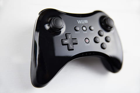 Nintendo Wii U Pro Controller shot against a white background, image captured with a Canon DSLR HD wallpaper